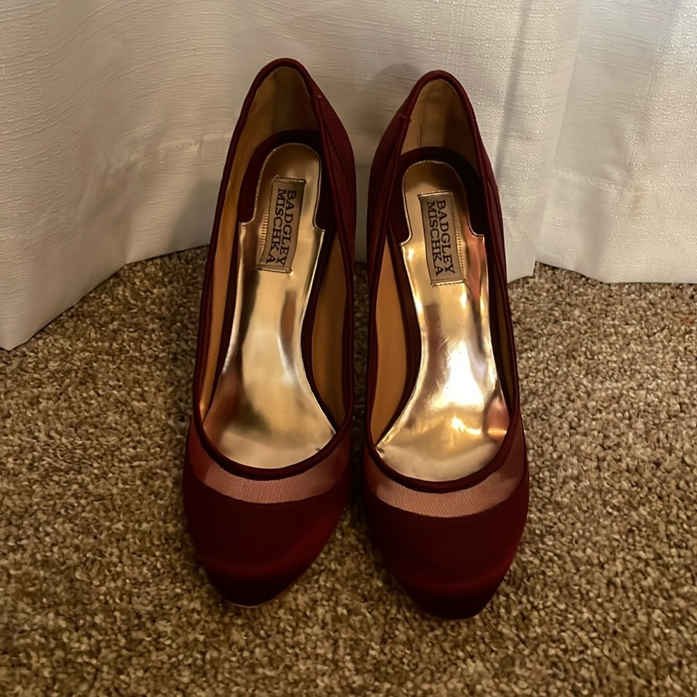 Badgley Mischka wine colored satin pump with mesh edge and gold detail on heel